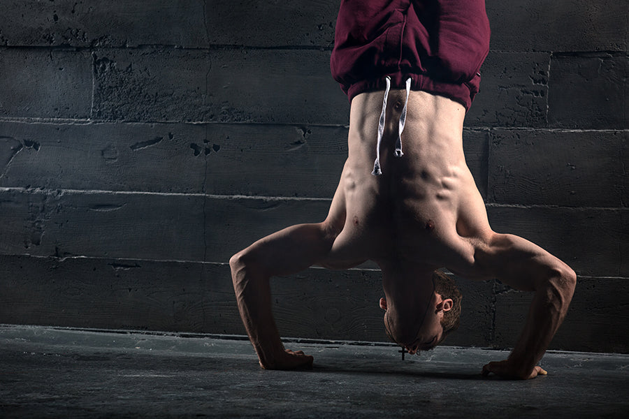 Learn how to perform the Handstand Push-Up with our technique, setup and  execution tips!
