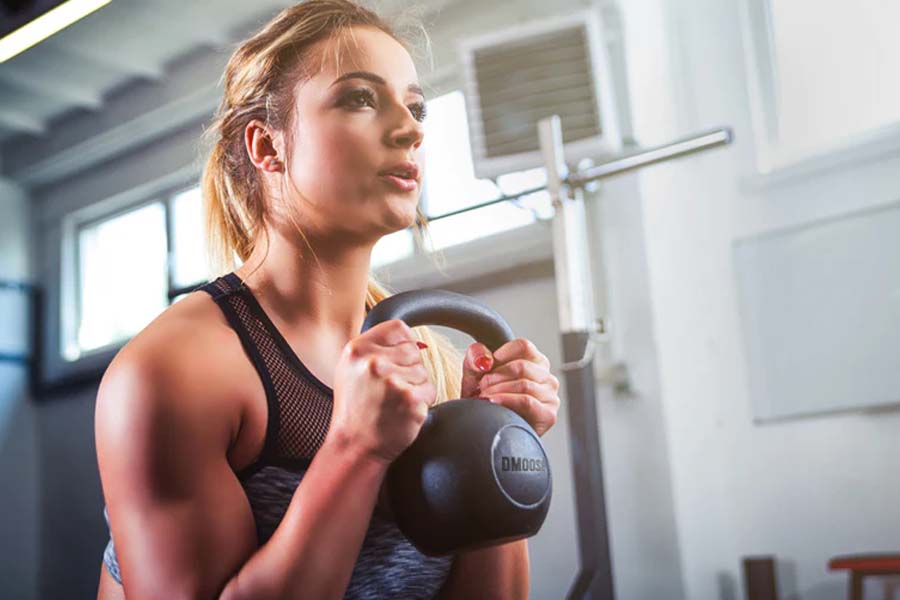 The Best Four-Move Kettlebell Workout to Build Upper Body Muscles
