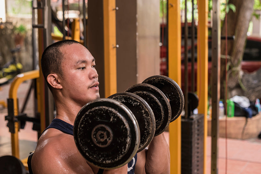 How to Do the Arnold Press: Benefits, Muscles Worked & the Modifications to Try