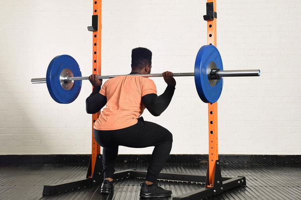 How to Use a Squat Rack: Beginner’s Guide & Safety Tips