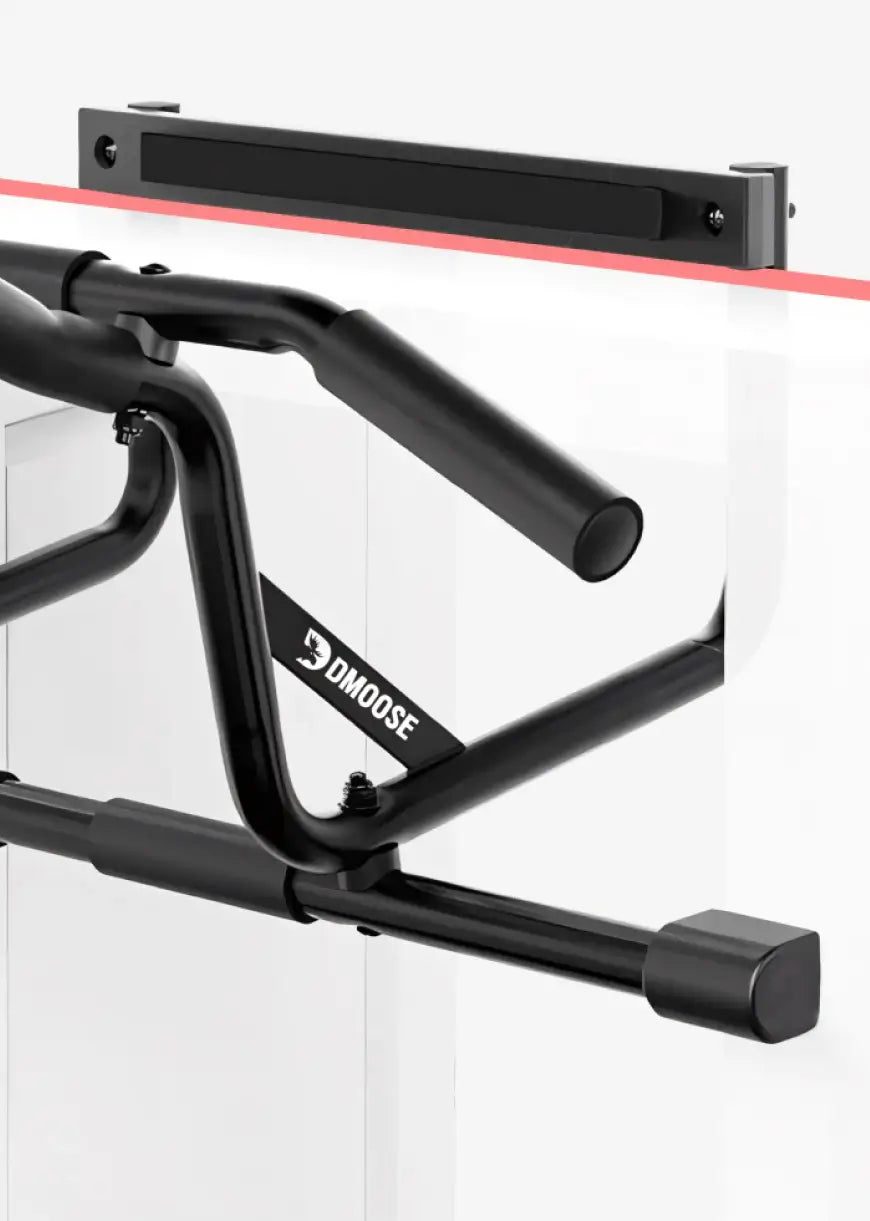 Pull-up bar hooked over a door frame, its extra-wide padded support bar resting flat across the top of the frame